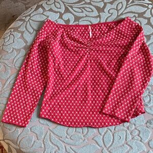 Free people red top with white embroidery.